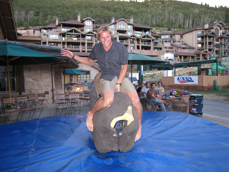 Cross country athlete Andy Newell gives the mechanical bull a shot (credit: Doug Haney/USSA)