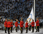 Royal Canadian Mounted Police color guard raises the Olympic flag at the Closing Ceremony of the 2010 Vancouver Olympic Winter Games. (Tom Kelly)