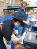 ussa > (l-r) Graham Watanabe and Nate Holland of U.S. Snowboarding signing the release forms before battling the mechanical bull (credit: Doug Haney/USSA)