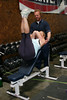 ussa > Erica Mueller demonstrates sit ups with the help of Per Lundstam. (Lindsey Sine/USSA)